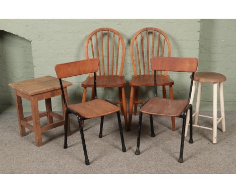 A collection of chairs and stools, to include two vintage Ercol dining chairs, model 290 and a painted stool.  Signs of worm.