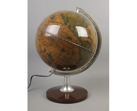 A french contemporary desk globe with interior light.  