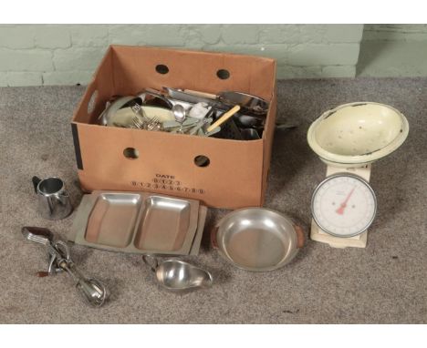 A box of assorted metalwares and kitchenalia to include Salter weighing scales, silver plate, flatware, serving dishes, etc. 