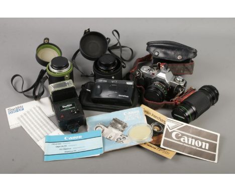 A camera bag with contents of Canon AV-1 camera, Olympus Trip 100, lenses, flash unit etc.  