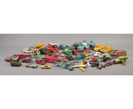 A collection of vintage play worn diecast vehicles, to include Corgi, Dinky and Matchbox examples.  