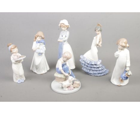 A collection of six Nao by Lladro figurines including Girl Holding Puppy With Blanket and Flamenco Dancer  