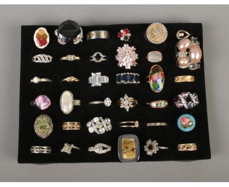 A collection of 36 costume jewellery dress rings to include titanium, mother of pearl and floral examples.  