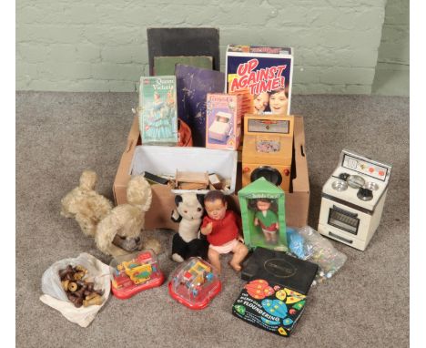 A box of vintage children's toys. Includes Casdon oven and washing machine, Punch Wizard and Stapler, marbles, chess pieces e