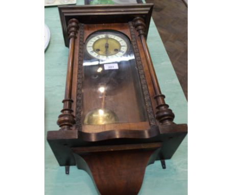 A mahogany wall clock