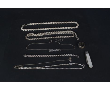 Two silver 'rope' necklaces, a similar bracelet, various other silver jewellery and a silver bladed mother of pearl fruit kni