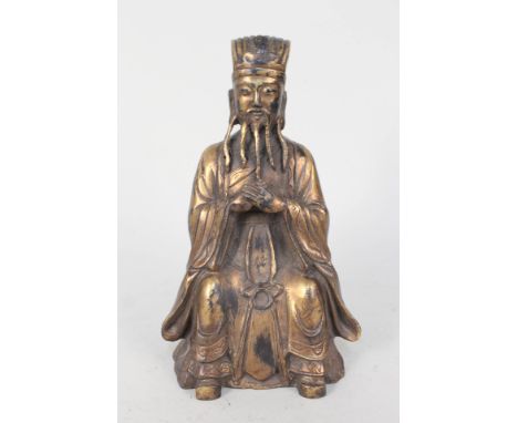 A Chinese gilt bronze figure of a seated sage with seal mark, height 10"