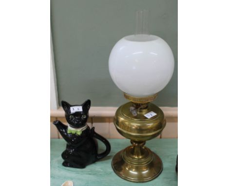 A brass oil lamp plus a Tony Wood cat teapot