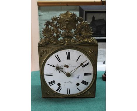 A 19th Century French wall clock with embossed brass front, dial signed Charles Thomas A Puy (chipped dial)