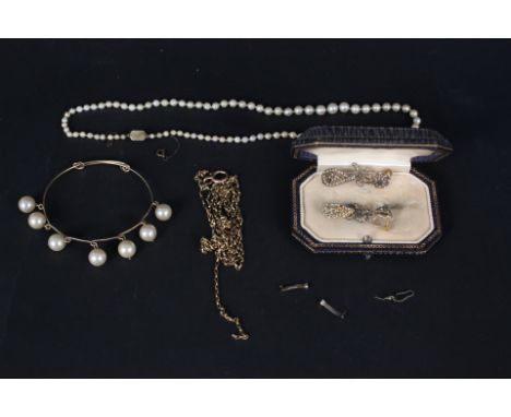 An unmarked gold long guard chain, a pearl necklace with 15ct gold clasp, a pair of filigree yellow metal seed pearl set drop