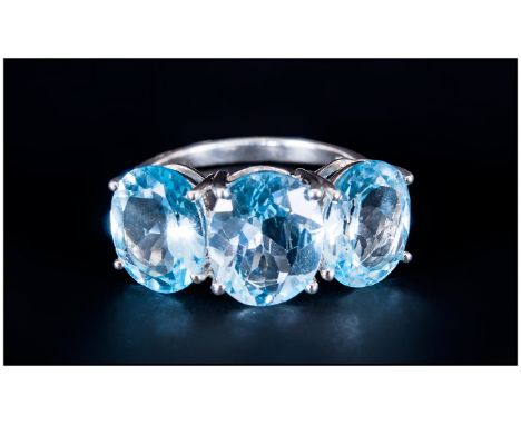 Sky Blue Topaz Three Stone Ring, the central oval cut topaz being 4.5cts, with the similar stones to either side measuring 3.