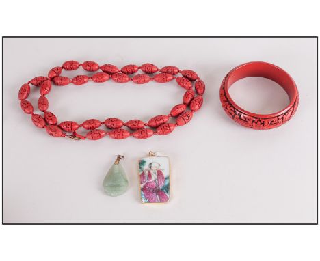 Cinnabar Lacquer Style Bangle and Necklace, plus a carved jade pendant and one made from broken Famille Rose porcelain showin