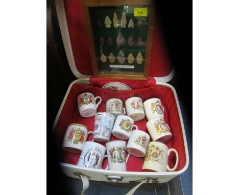 A cased display of native American Points, Neolithic in glazed case, a collection of ceramic commemorative mugs in a small su