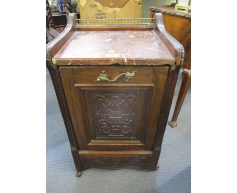 A mahogany cased coal scuttle with drop down door and lead lined bucket within, having a pink marble top A/F, on castors toge