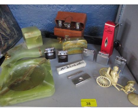A quantity of 20th century lighters to include Ronson and Collibri, together with smoking accessories, a celluloid model of a