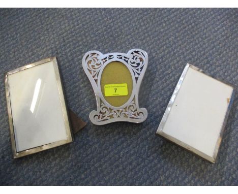 Three silver photo frames 