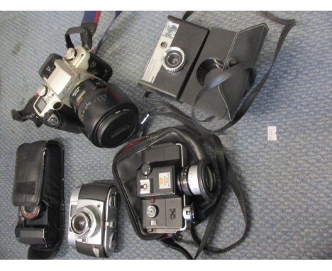 A Canon EOS 50E camera, a Vario Balda camera, a Canon Super Shot 38mm camera, a Minolta 110 zoom SLR camera and a Kodak insta