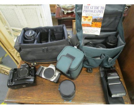 A Minolta Dynax 600 Si Classic camera with various Sigma lens and a Canon EO5 300 camera and lens, in camera bags with associ