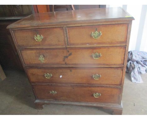 A Georgian oak chest of two short and three long drawers, standing on bracket shaped feet, 10"h x 98"w 