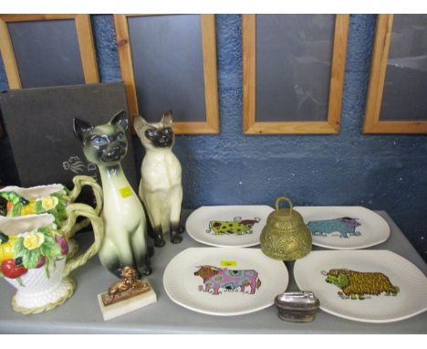 A retro Beefeater Steak and Grill set of four plates by English Ironstone Pottery Ltd, depicting bulls in various retro patte