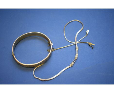 A 9ct gold necklace set diamond chips, 7.7g; together with a 9ct gold bangle having metal core.