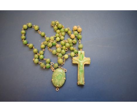 A carved jade and stone rosary bead necklace, 128cm.