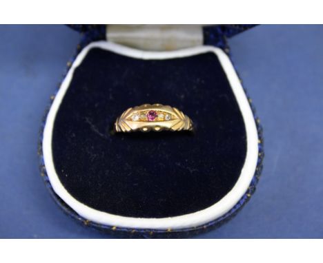 An Edwardian 18ct gold ruby and diamond ring.  Condition Report: Mount rubbed, shank worn/thin. Stones all present, one possi