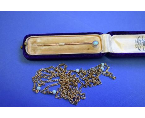 A cased unmarked yellow metal tie pin set opal; together with a cased unmarked insect pearl and sapphire bar brooch; and a 9c