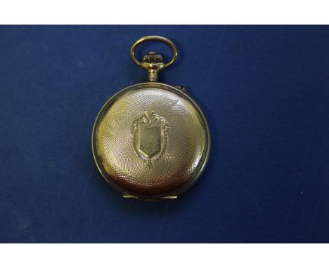 A 14k gold engine turned ladies fob watch, Swiss movement, stem wind, having white enamel dial and Arabic numerals, 19.2g inc