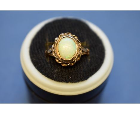 A 9ct gold and opal ring; together with a jade set example; and a cameo example.