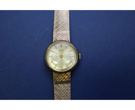 A vintage Tudor Royal 9ct gold ladies mechanical wristwatch, on a 9ct gold mesh bracelet. Condition Report: Winds NOT ticking