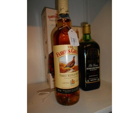 A boxed bottle of Famous Grouse Scotch Whiskey and a boxed  bottle of 12 year old Bells