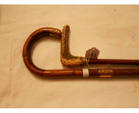 An early 20th C cane walking stick with yellow metal knop and ferrule together with another handled cane 