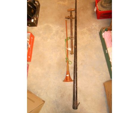 A vintage E. Diggle snooker cue and a metal case with a copper and brass hunting horn and a brass garden pump 