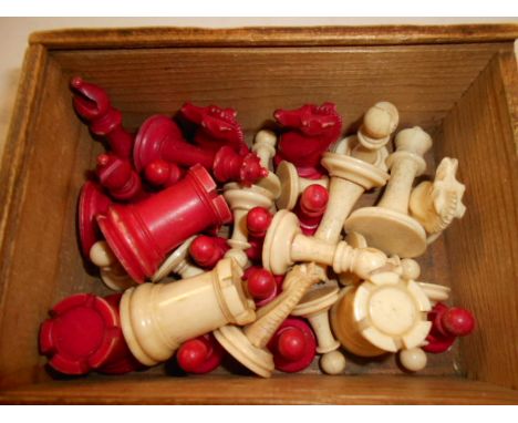 A 19th C ivory red and white chess set, possibly Staunton