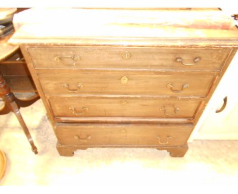 An early 19th C mahogany chest of four graduating cock-beaded drawers each with brass swan neck handles and escutcheon's rais