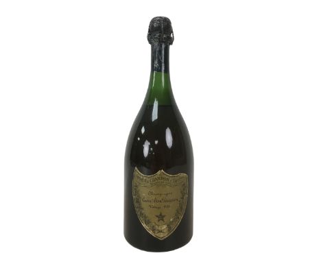 Vintage champagne, a bottle of Moet & Chandon Cuvee Dom Perignon, vintage 1964, U: mid-shoulder, label and capsule worn. 