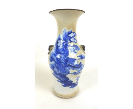 A Chinese porcelain vase, Qing Dynasty, 19th century, of baluster form with twin applied lion dog and ring handles to the sho