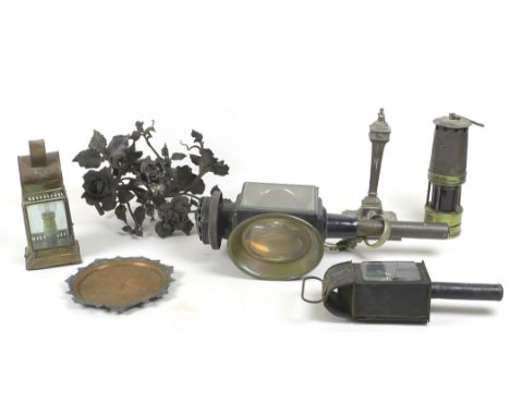 A collection of metal wares, including a miner's lamp, three carriage lamps, one marked 'GR East India Company', metal flower