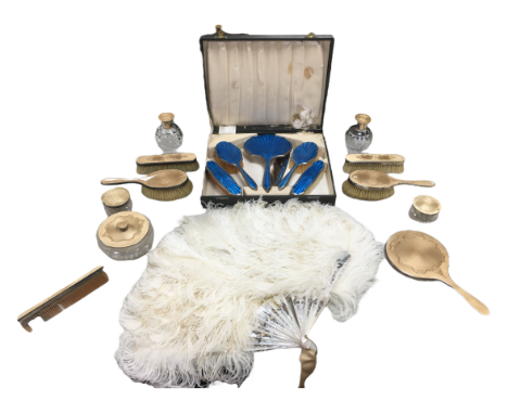 A group of dressing table items, comprising an eleven piece silver and pale gold guilloche enamel set, with hair brushes, mir