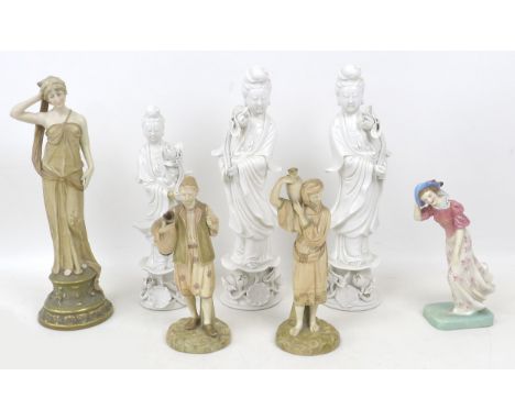 A group of ceramic figurines, a pair of Royal Worcester blush ivory, model 1206, modelled as a man and woman each carrying a 