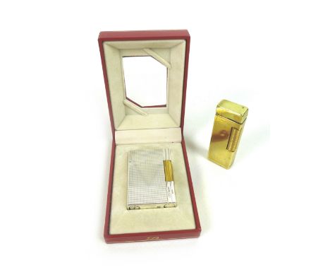Two vintage lighters, comprising a S.T. Dupont lighter Ligne, plaque argent G, diamond pattern, housed in original box, toget
