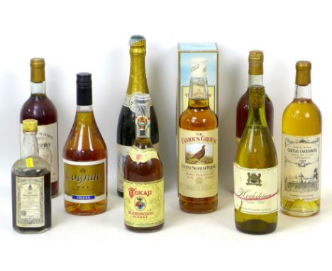 A group of vintage wine and spirits, including a bottle of 1964 Chateau Carbonnieux, Leognan. (9) 