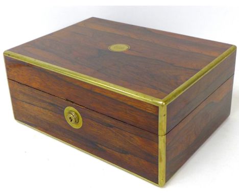 A Victorian coromandel and brass inlaid travel case, with a fitted interior featuring silver mounted jars, a manicure set, a 