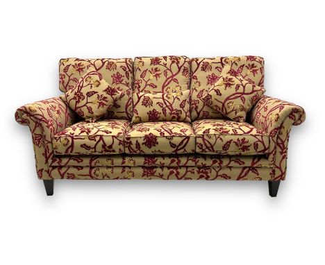 Contemporary upholstered three-seat sofa, scroll arms and loose cushions, embossed beige ground fabric with red and gold flor