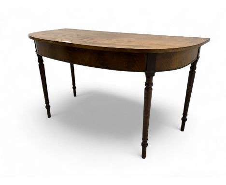 George III mahogany D-end console table, demi-lune top over figured frieze, on ring turned supportsDimensions: Height:&nbsp;7