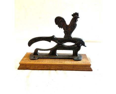 Vintage nut cracker on wooden base 