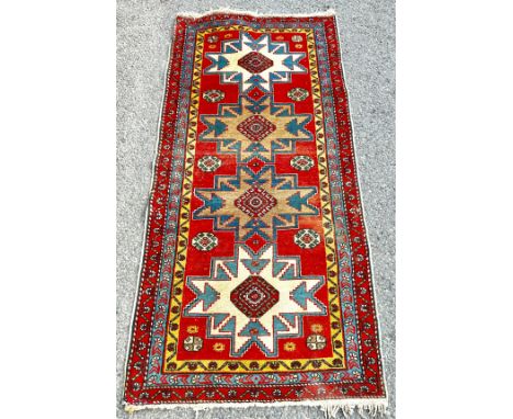 Vintage lounge rug, approximate measurements: 62 x 29 inches, some sun bleaching 