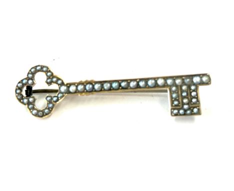 Antique unmarked gold seed pearl brooch in the form of a key, approximate weight 3.8g, approximate length 2 inches 