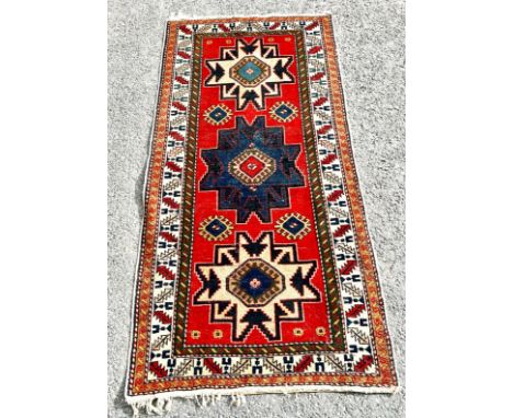 Vintage lounge rug, approximate measurements: 62 x 29 inches 